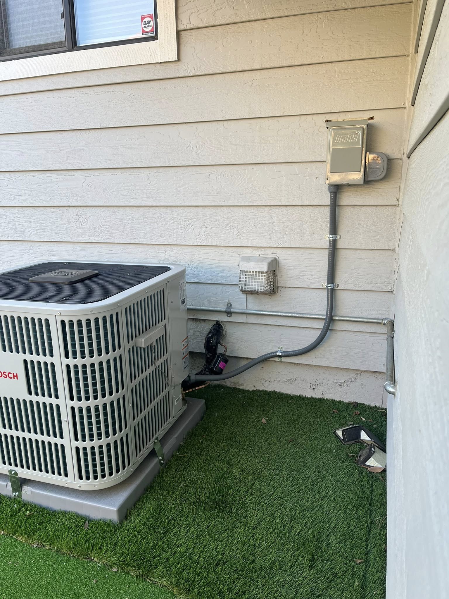 Bosch AC condenser unit installed outside